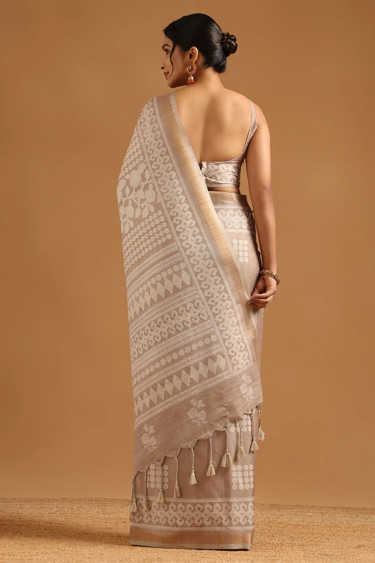 Beige Art Silk Ethnic Motifs Saree With Tassels